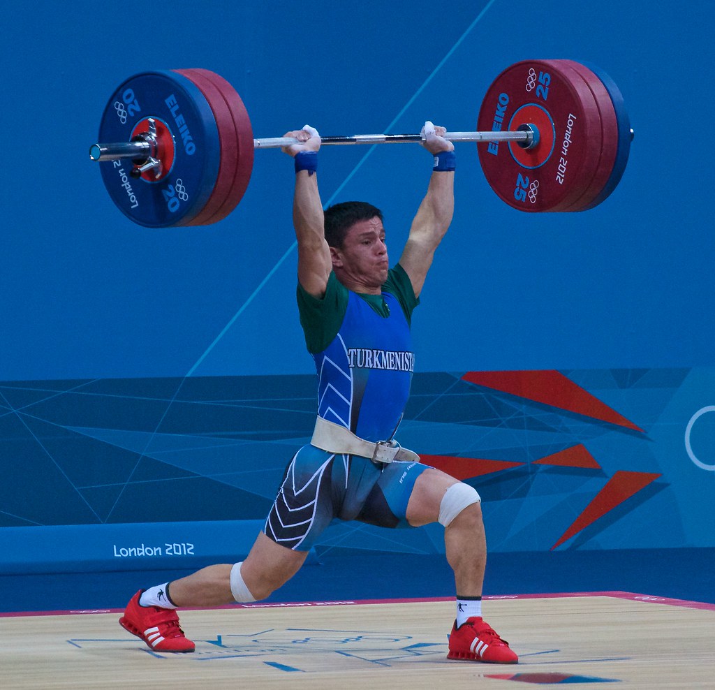 Olympic weightlifter performing Snatch and Clean and Jerk