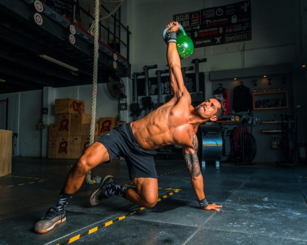 Man performing kettlebell swing during a CrossFit workout