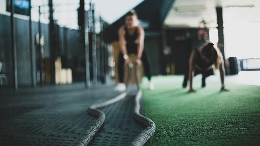 A person executing a push-up during a Circuit Training 20-Minute Workout session.