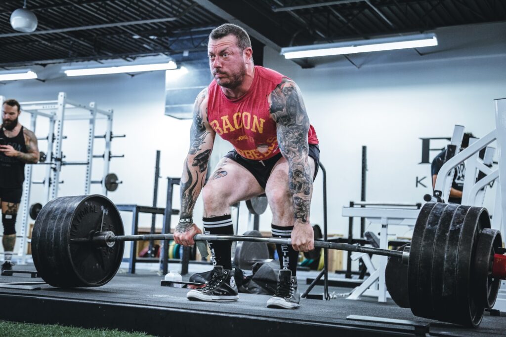 Person performing a deadlift with proper form.