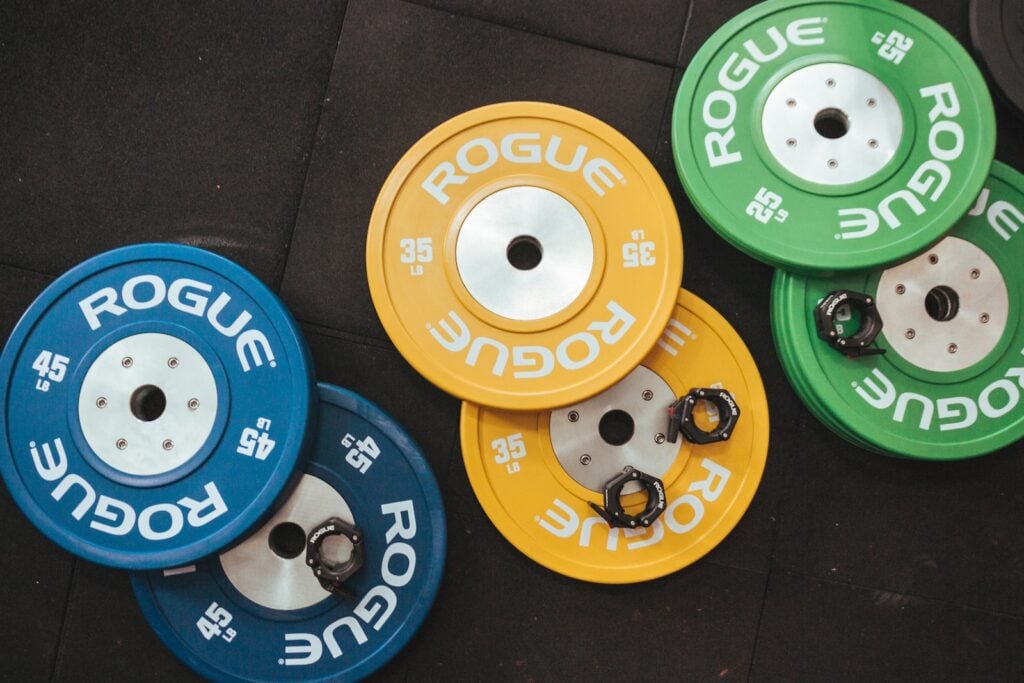 Barbell weights scattered on the gym floor.