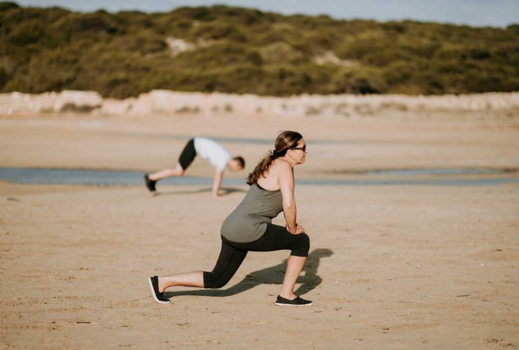 Woman performing lunges to target hamstrings for diverse fitness goals like strength, endurance, and aesthetics.