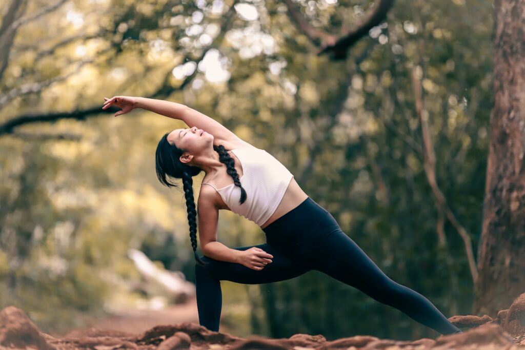 A person demonstrating a hamstring stretch, emphasizing the importance of stretching for overall well-being.