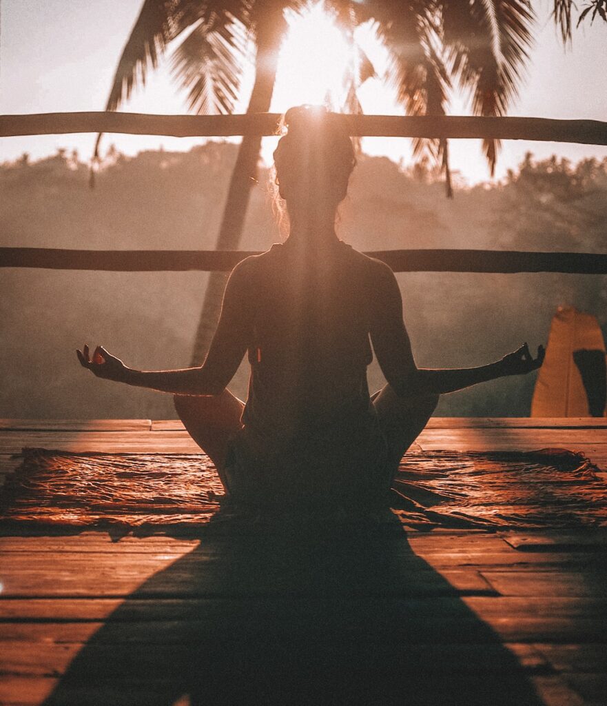 Person practicing yoga breathing techniques for anxiety relief